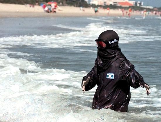 A moon child at the beach in protective gear