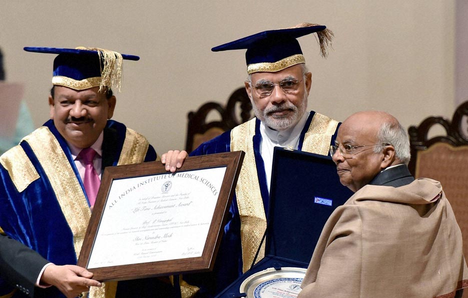 Dr P Venugopal receiving the Lifetime Achievement Award from PM Narendra Modi